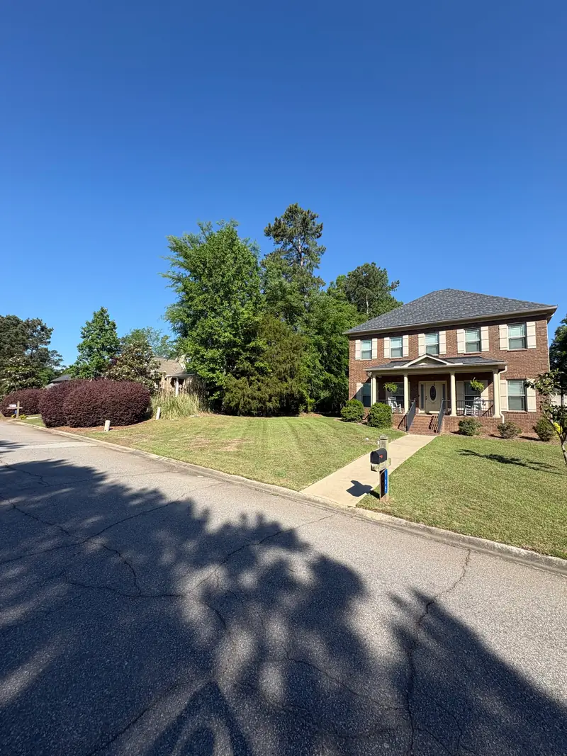 Mowed lawn and tidy edges on a corner lot