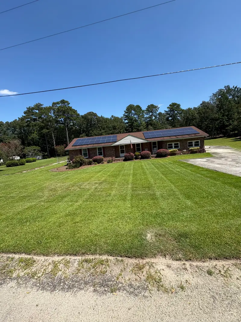 Freshly mowed striped lawn at a ranch home